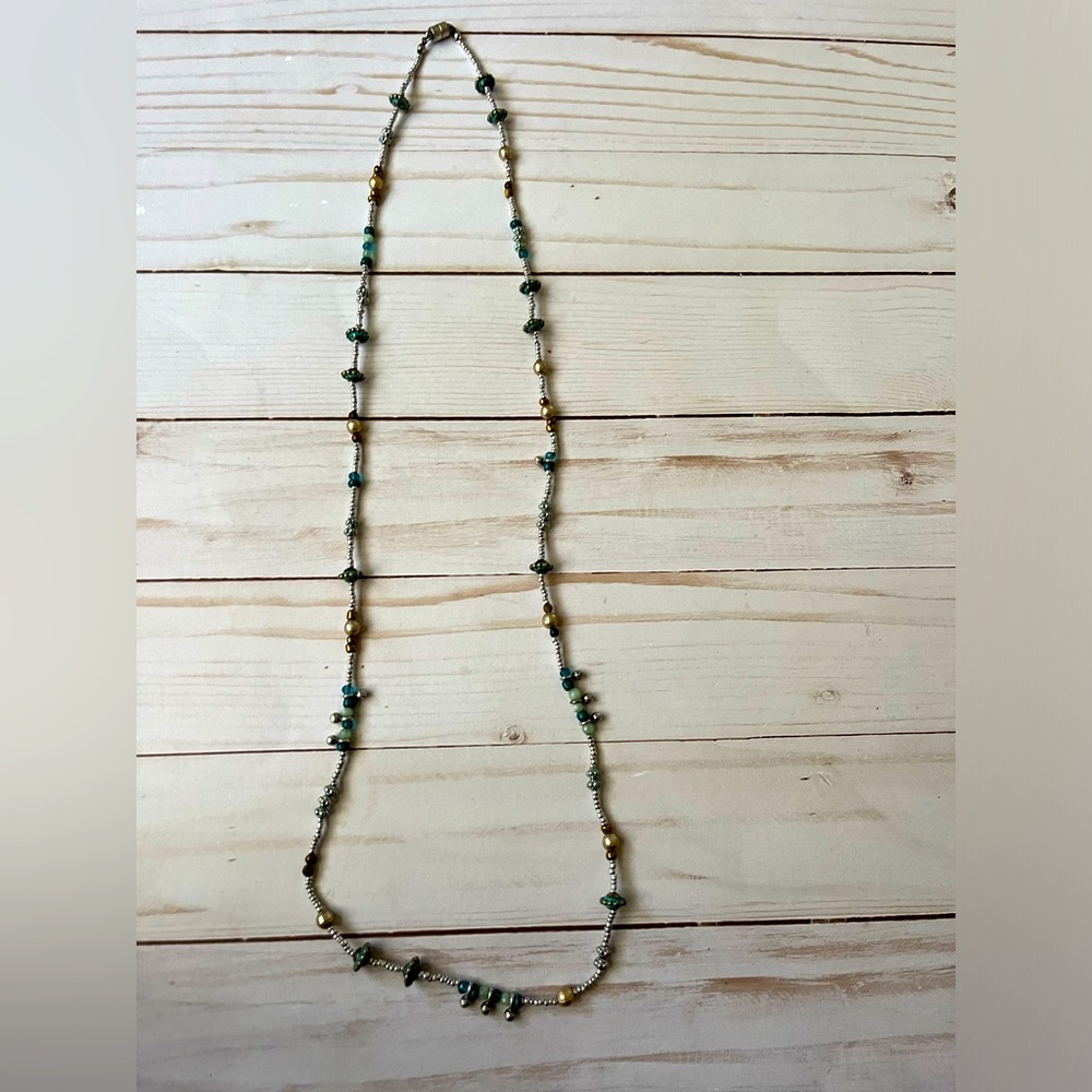 Long turquoise, silver, and gold bead necklace